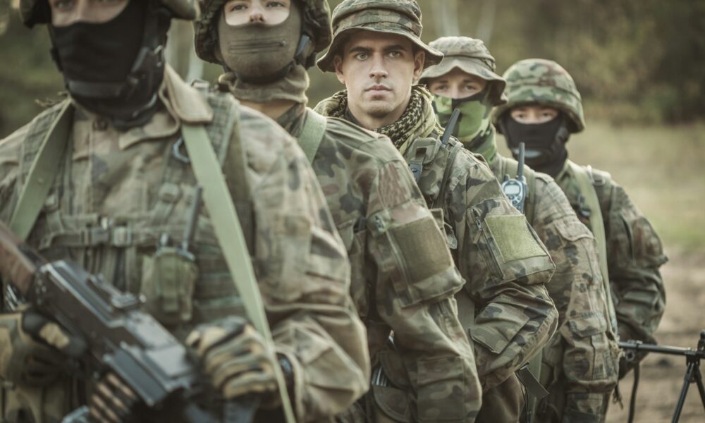 Armed young masked soldiers