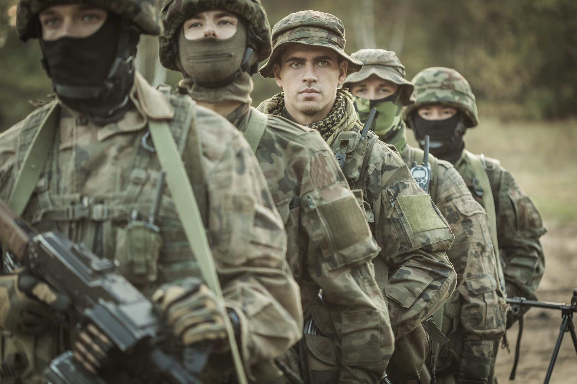 Armed young masked soldiers