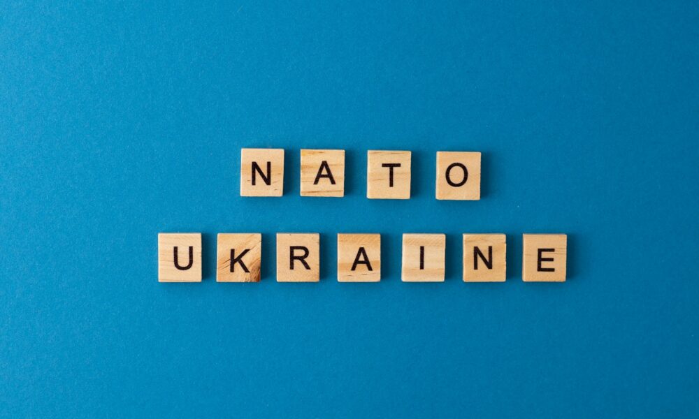 NATO Ukraine.The phrase is laid out in wooden letters. Top view. Motivation.