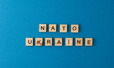 NATO Ukraine.The phrase is laid out in wooden letters. Top view. Motivation.